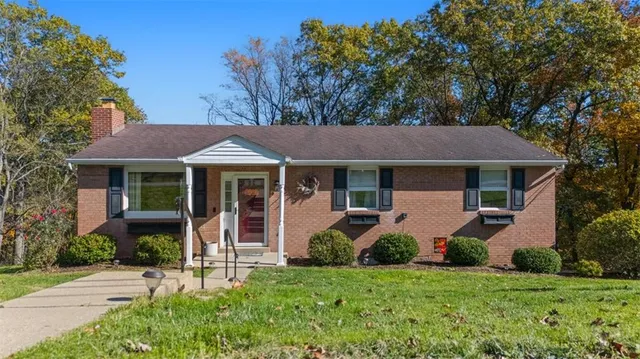 front view of a house with a yard