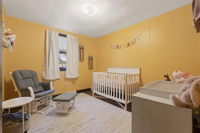 a bedroom with furniture and a window