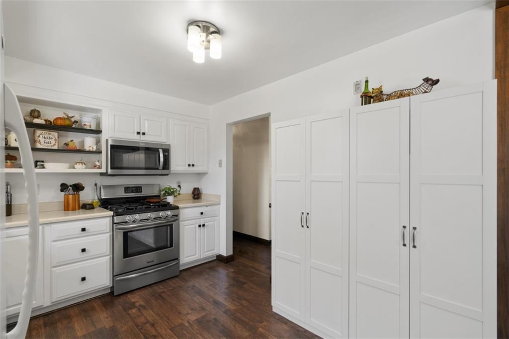 170 Ralston Road Sarver, PA 16055 - Photo 10 of 28 a kitchen with cabinets stainless steel appliances and wooden floor