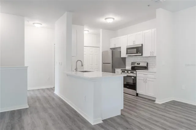 a view of kitchen with wooden floor