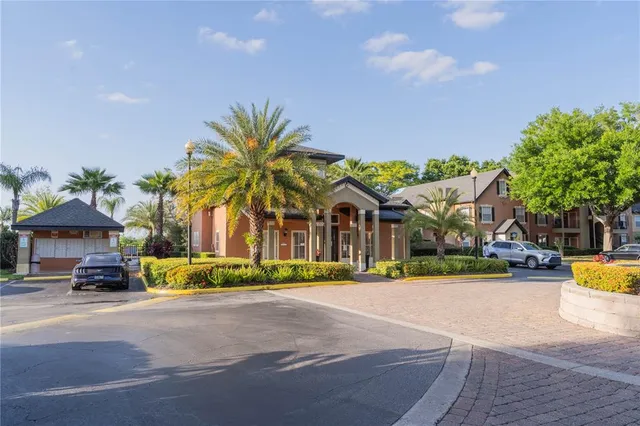 a view of a palm trees in front of a house