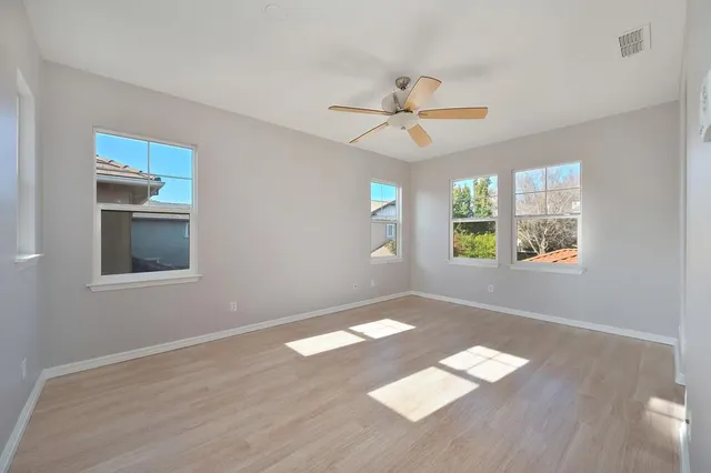 a bathroom with a tub a sink shower and mirror