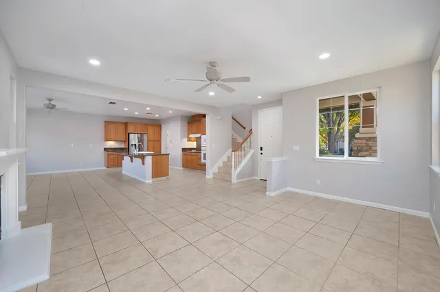 a view of kitchen with furniture and refrigerator