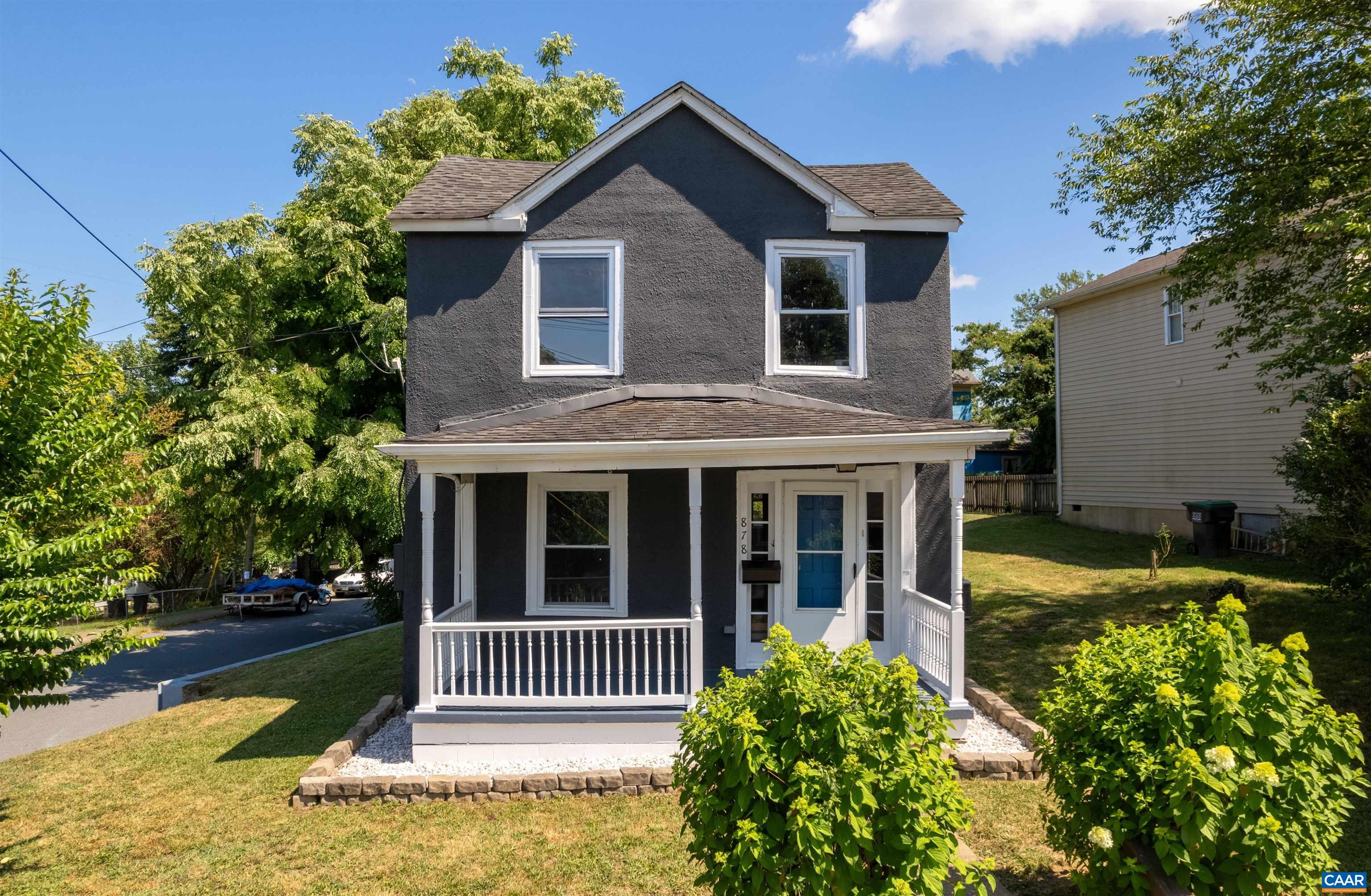 a view of house with yard and entertaining space
