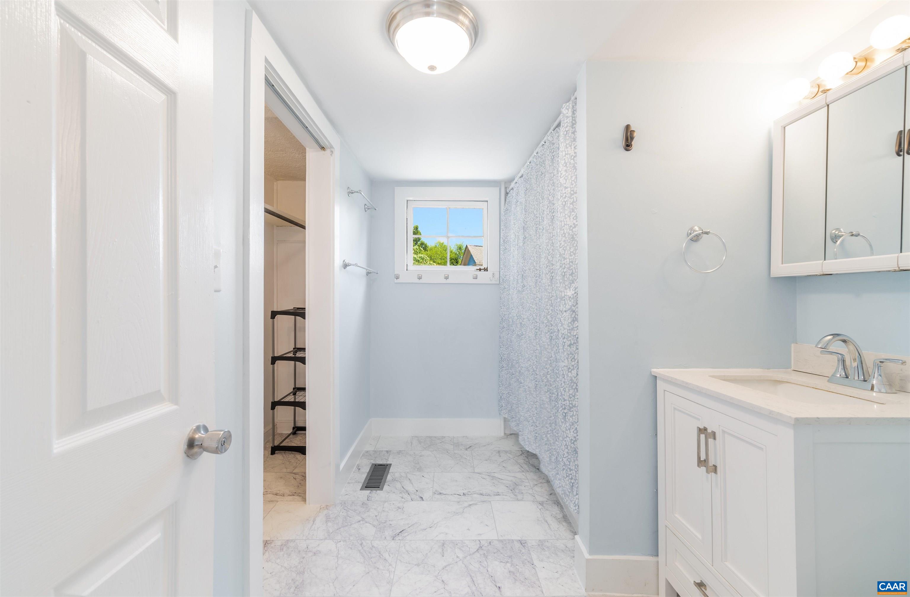 878 Ridge Street Charlottesville, VA 22902 - Photo 6 of 40 a bathroom with a sink and a shower
