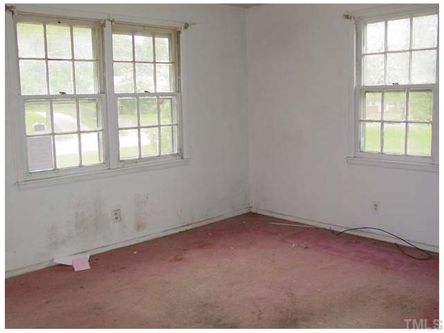 913 Newcombe Road Raleigh, NC 27610 - Photo 2 of 5 an empty room with a window