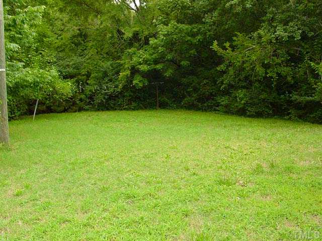 913 Newcombe Road Raleigh, NC 27610 - Photo 5 of 5 a view of field with trees in the background