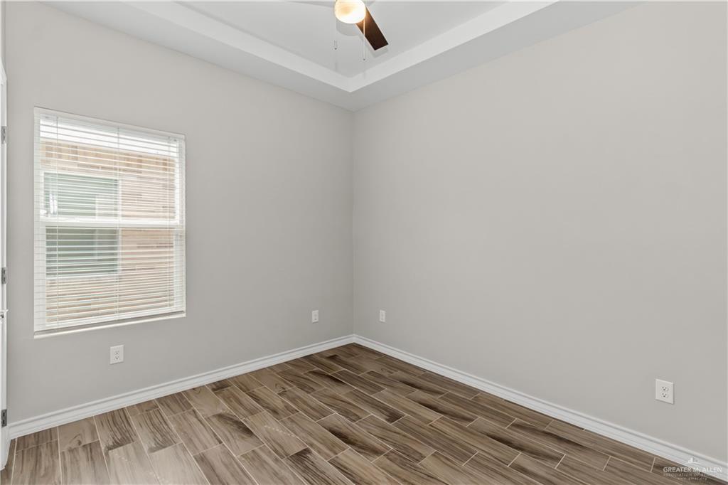 2804 West Israel Avenue, Unit 2 Alton, TX 78573 - Photo 10 of 12 an empty room with a window