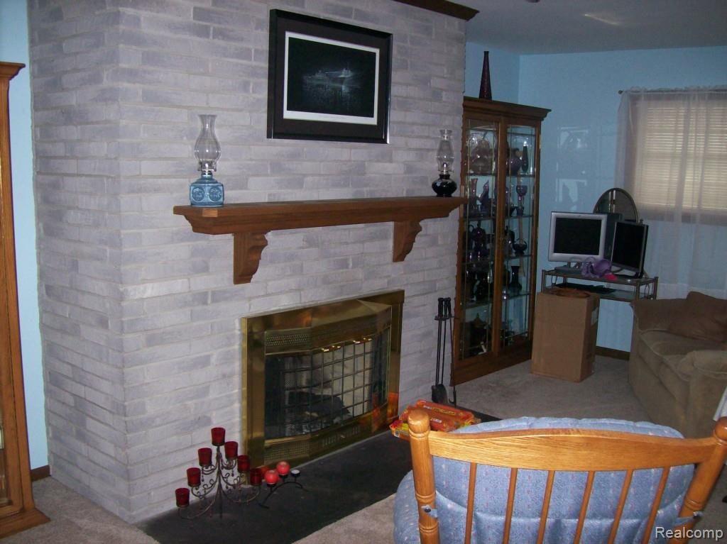 5960 Newman Road St. Clair, MI 48079 - Photo 8 of 12 FAMILY ROOM WITH FIREPLACE