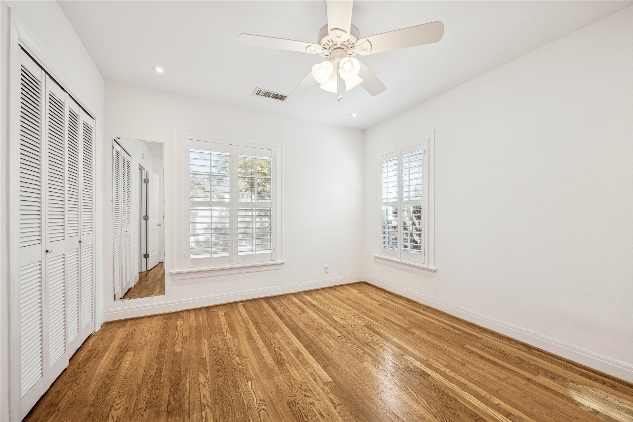 2409 Dryden Road Houston, TX 77030 - Photo 17 of 32 The upstairs secondary bedroom offers a comfortable, private retreat with flexibility for guests, family, or a home office.