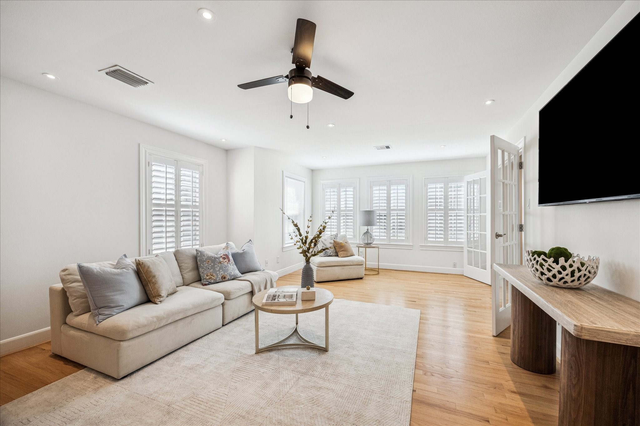 2409 Dryden Road Houston, TX 77030 - Photo 23 of 32 Whether set up for casual lounging, conversation, or entertaining, the room easily adapts to a variety of lifestyles and needs. Its open connection to the kitchen enhances the flow, making it a comfortable and inviting space for everyday living.
