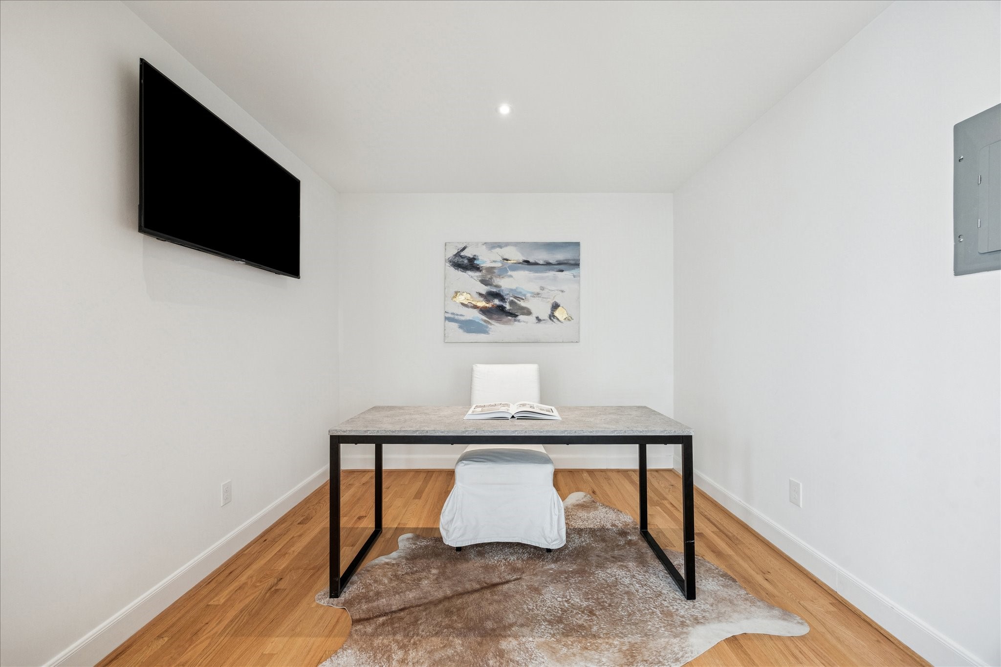 2409 Dryden Road Houston, TX 77030 - Photo 24 of 32 A dedicated media room adds an additional layer of comfort and entertainment, perfect for movie nights or relaxing downtime. Currently shown as a private study for the apartment.