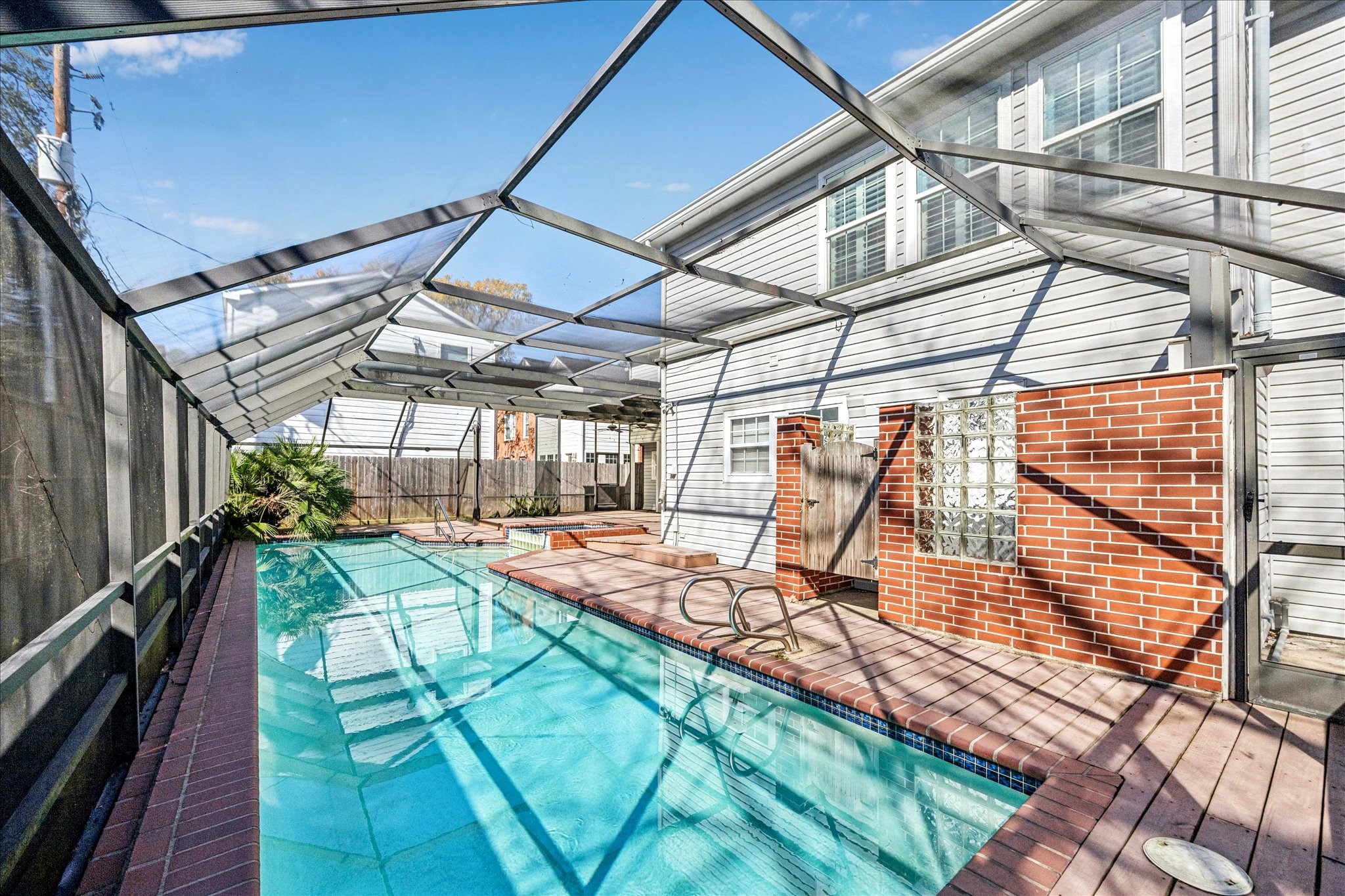 2409 Dryden Road Houston, TX 77030 - Photo 31 of 32 The space offers plenty of room for outdoor dining and gathering. A dedicated lounging area creates the perfect spot to unwind and enjoy the serene setting.