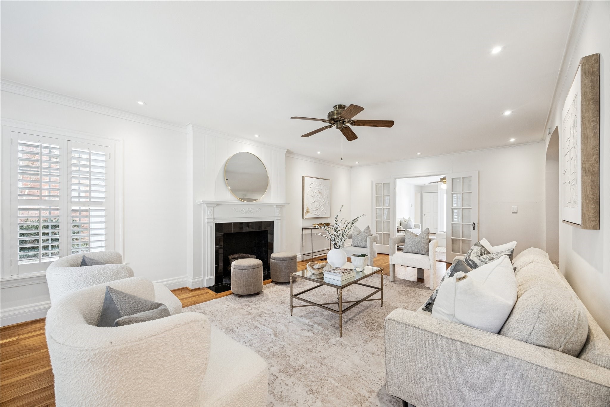 2409 Dryden Road Houston, TX 77030 - Photo 4 of 32 The space connects effortlessly to the kitchen, making it ideal for entertaining or everyday living. With direct access to the stairway and second floor, this room serves as a beautiful and functional centerpiece of the home.