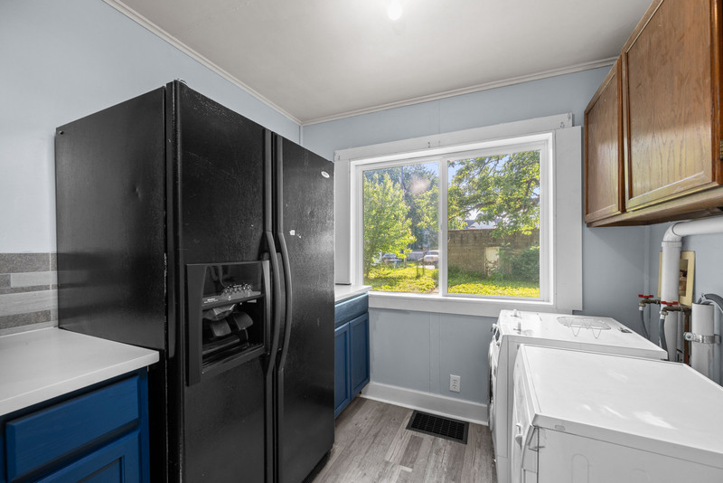 1419 17th Street Moline, IL 61265 - Photo 22 of 28 a kitchen with a refrigerator and a sink