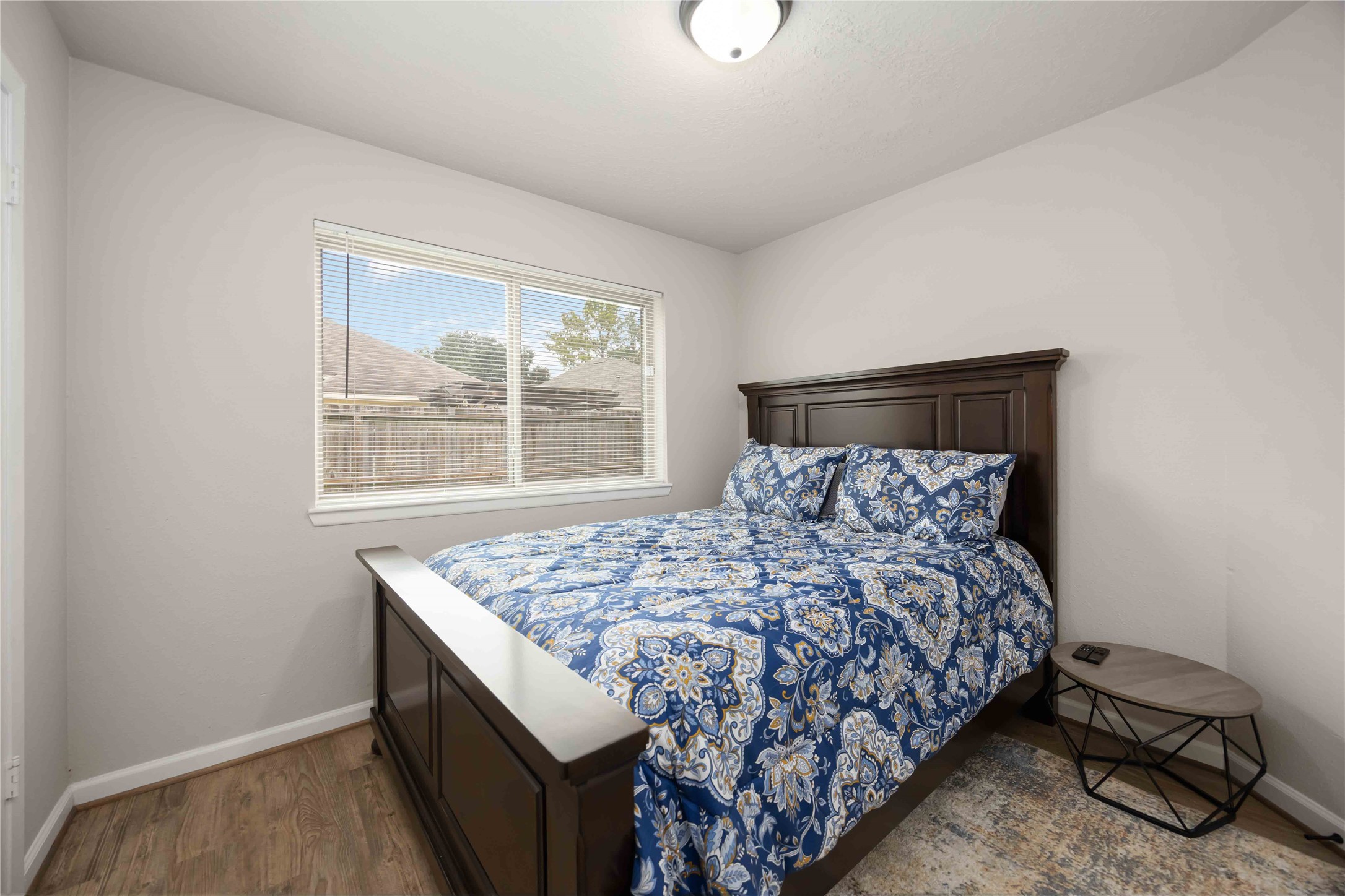 4811 Tealgate Drive Spring, TX 77373 - Photo 16 of 25 a bed sitting in a bedroom next to a window