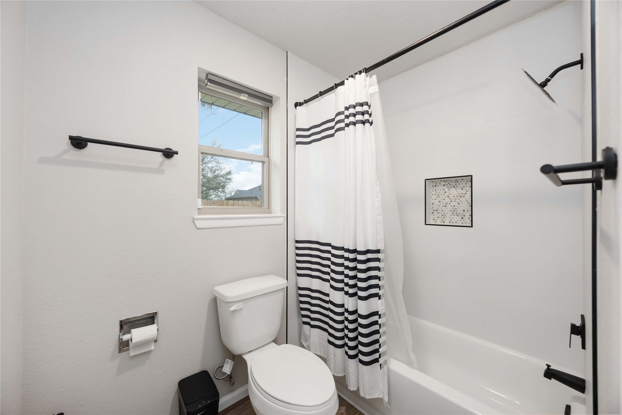 4811 Tealgate Drive Spring, TX 77373 - Photo 19 of 25 a white toilet sitting next to a bathroom sink and tub