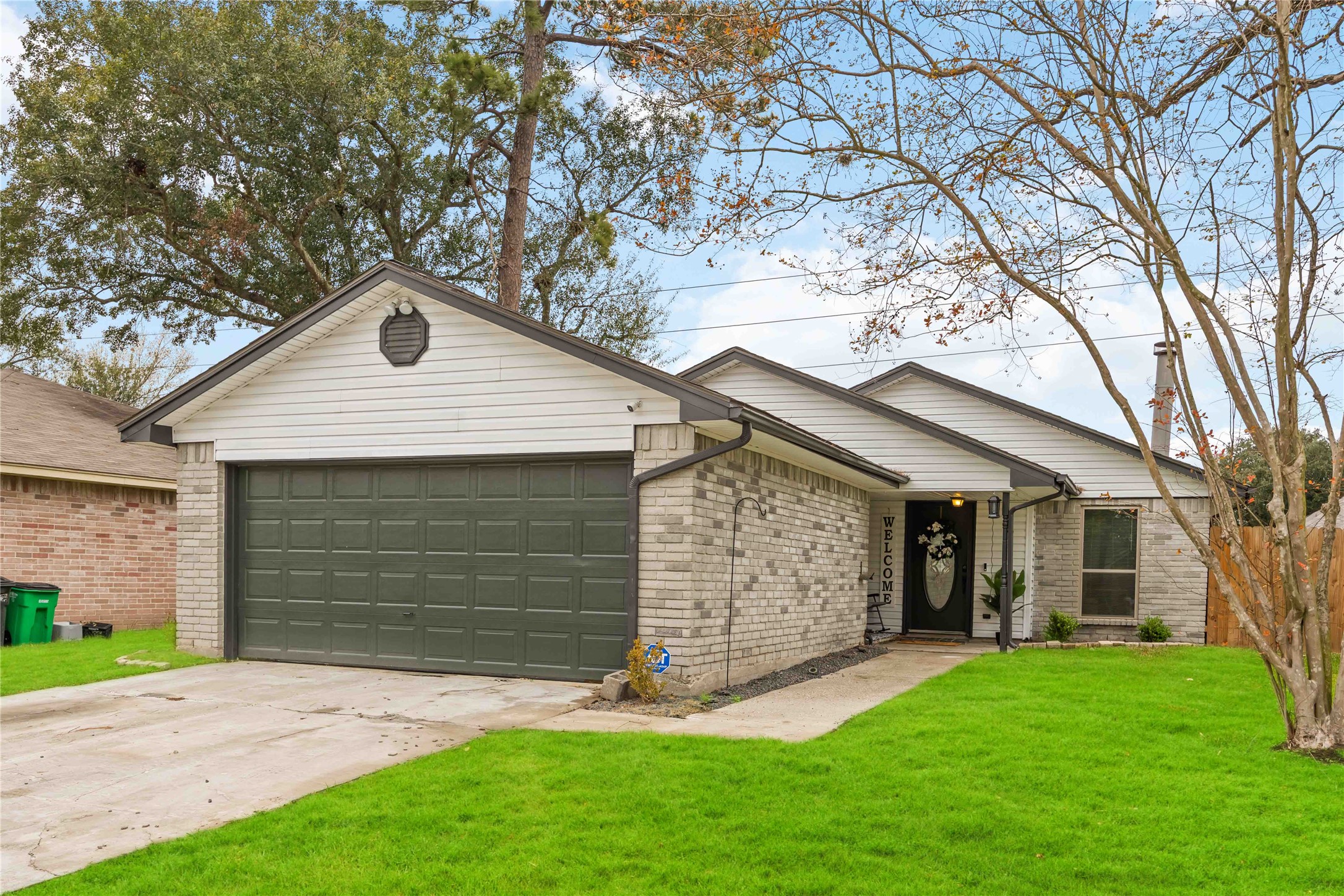4811 Tealgate Drive Spring, TX 77373 - Photo 23 of 25 a front view of a house with a yard and garage