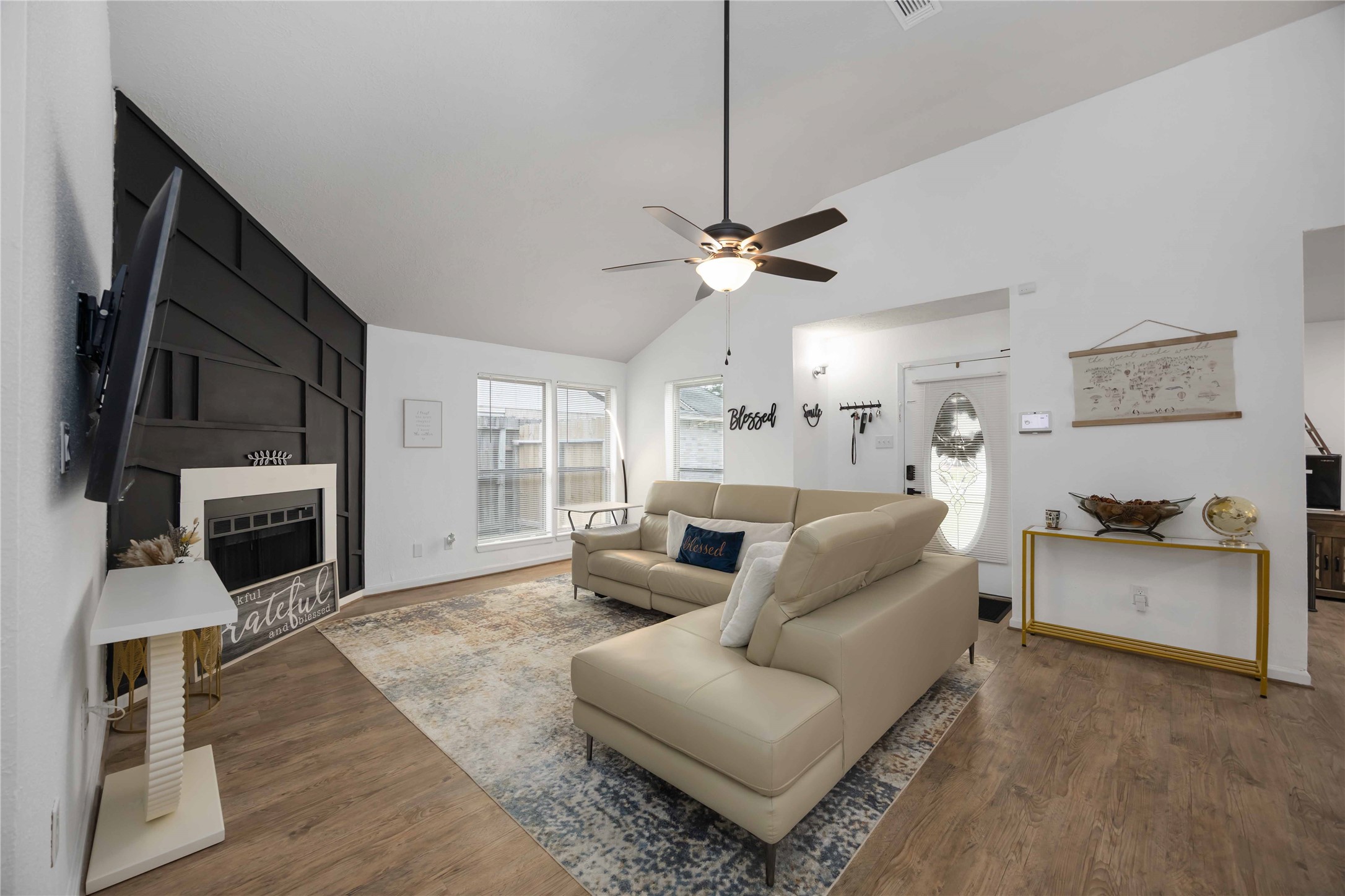 4811 Tealgate Drive Spring, TX 77373 - Photo 5 of 25 a living room with furniture a fireplace and a flat screen tv