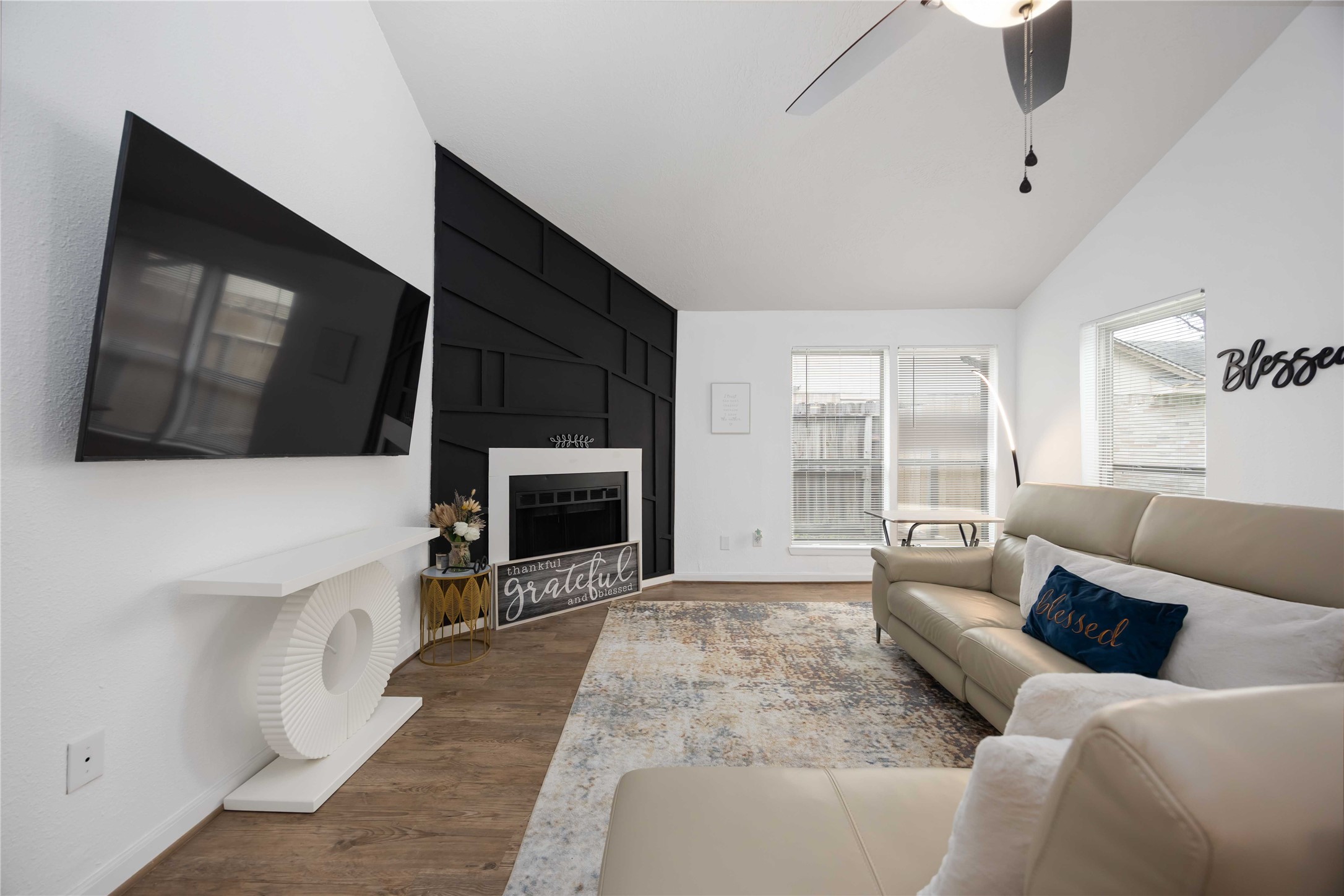 4811 Tealgate Drive Spring, TX 77373 - Photo 6 of 25 a living room with furniture a fireplace and a flat screen tv