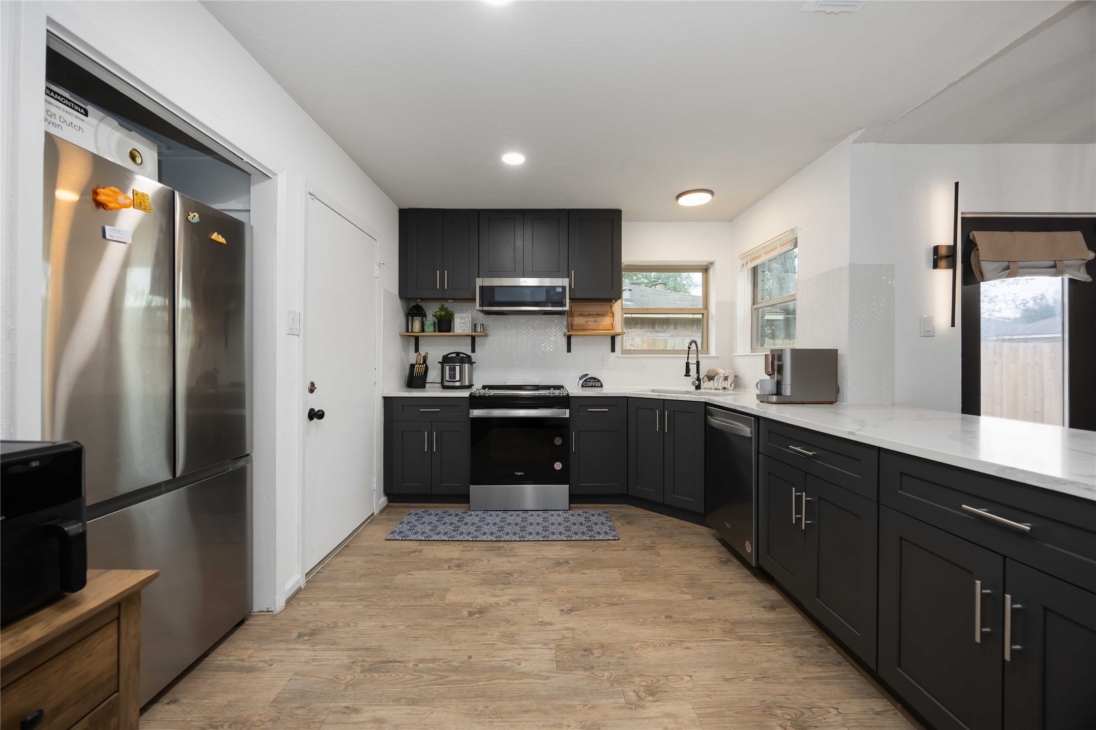4811 Tealgate Drive Spring, TX 77373 - Photo 10 of 25 a kitchen with stainless steel appliances granite countertop a refrigerator and a sink