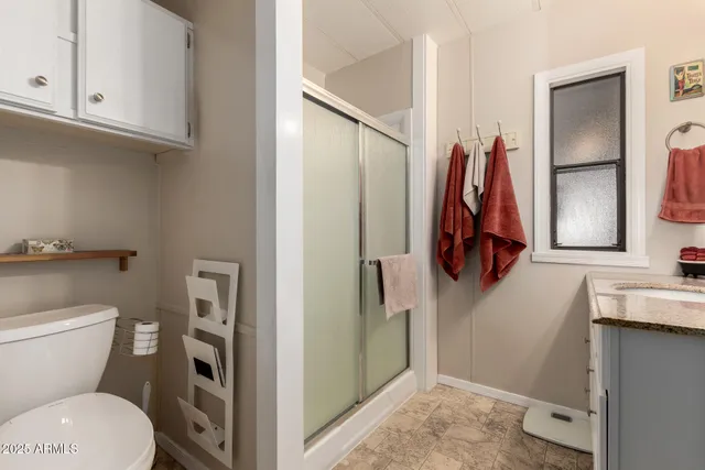 a bathroom with a sink vanity and mirror