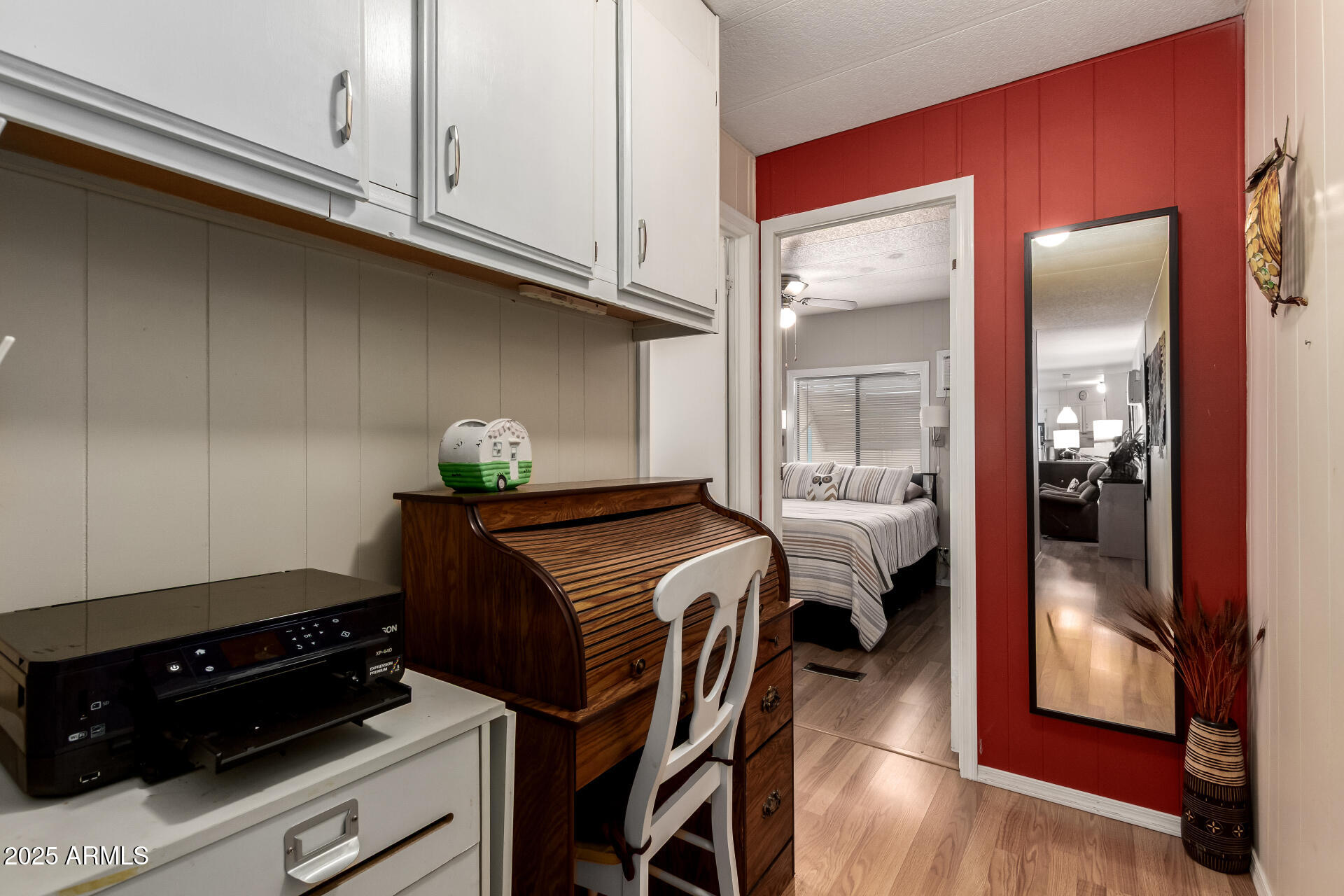 11425 East University Drive, Unit 53 Apache Junction, AZ 85120 - Photo 18 of 29 a bedroom with a bed and a mirror