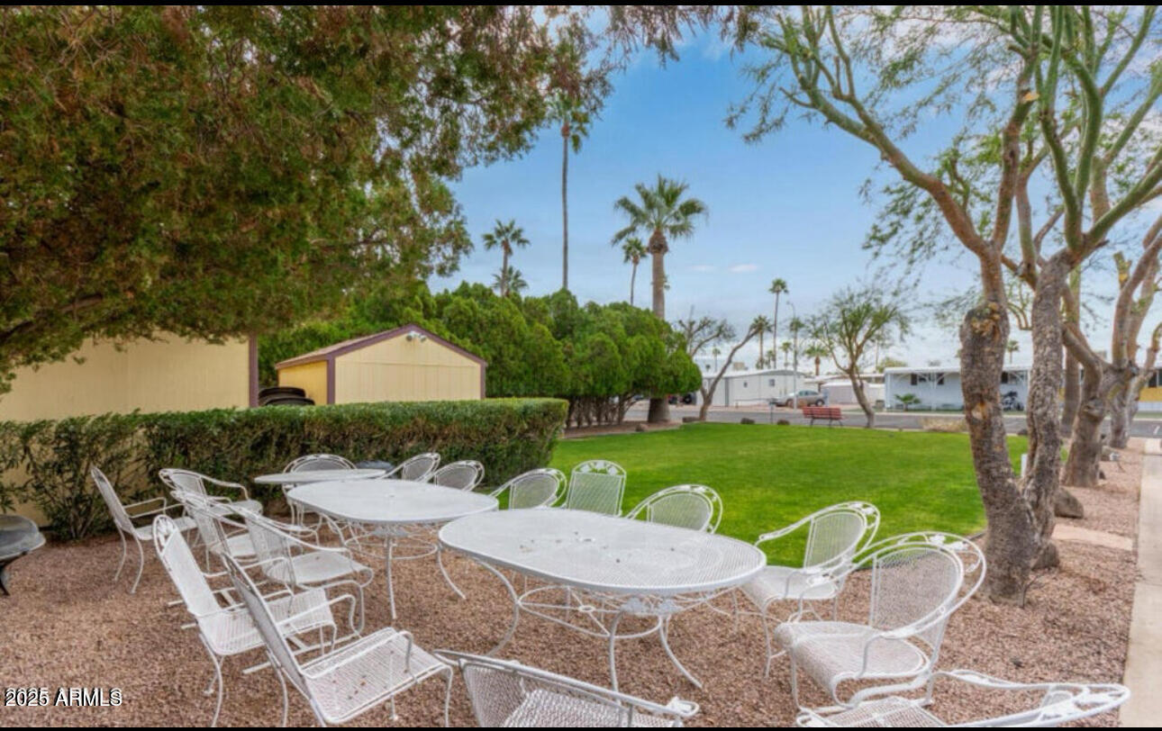 11425 East University Drive, Unit 53 Apache Junction, AZ 85120 - Photo 25 of 29 a view of a patio with garden