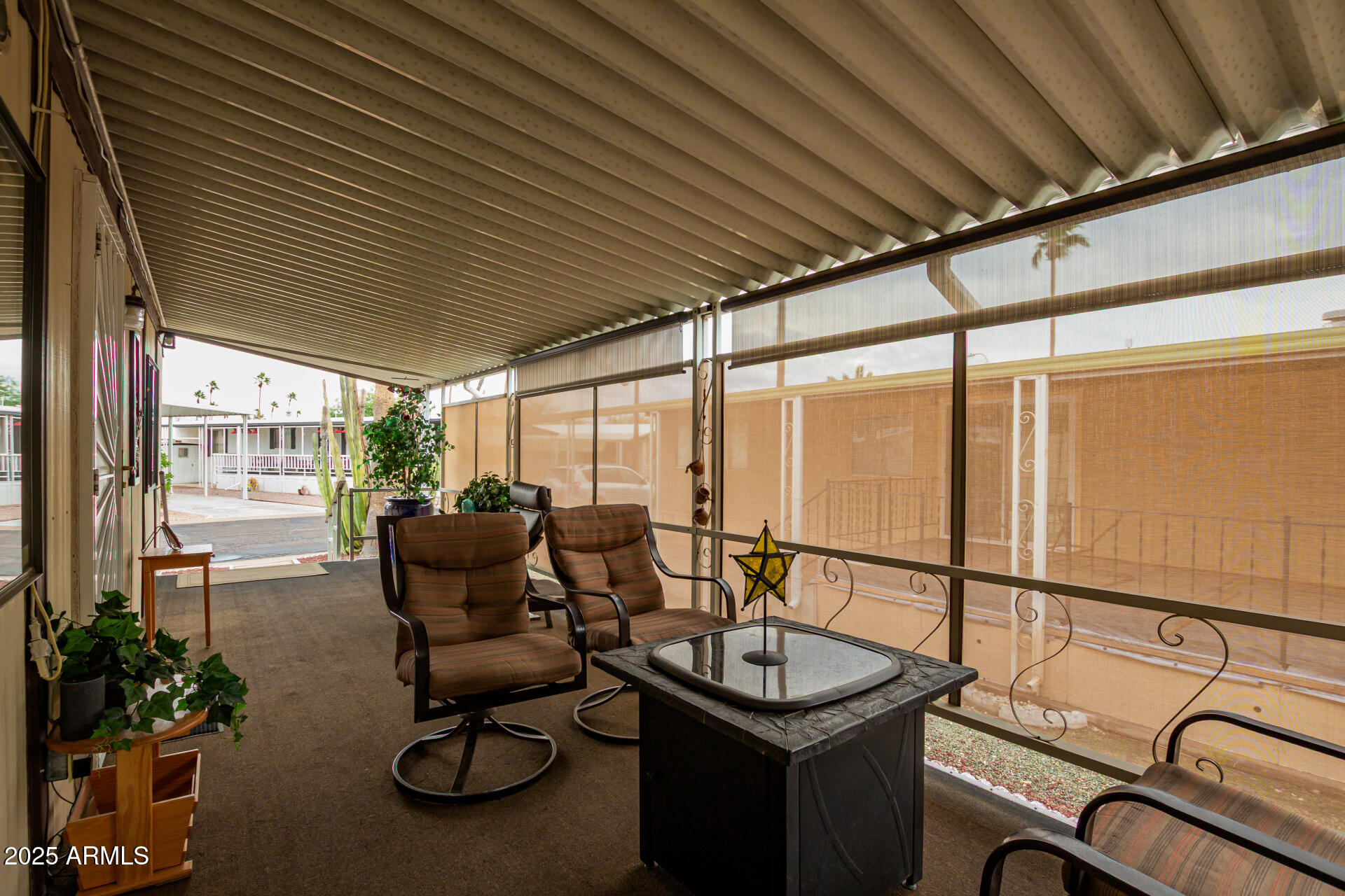11425 East University Drive, Unit 53 Apache Junction, AZ 85120 - Photo 5 of 29 a view of a patio with chairs and tables