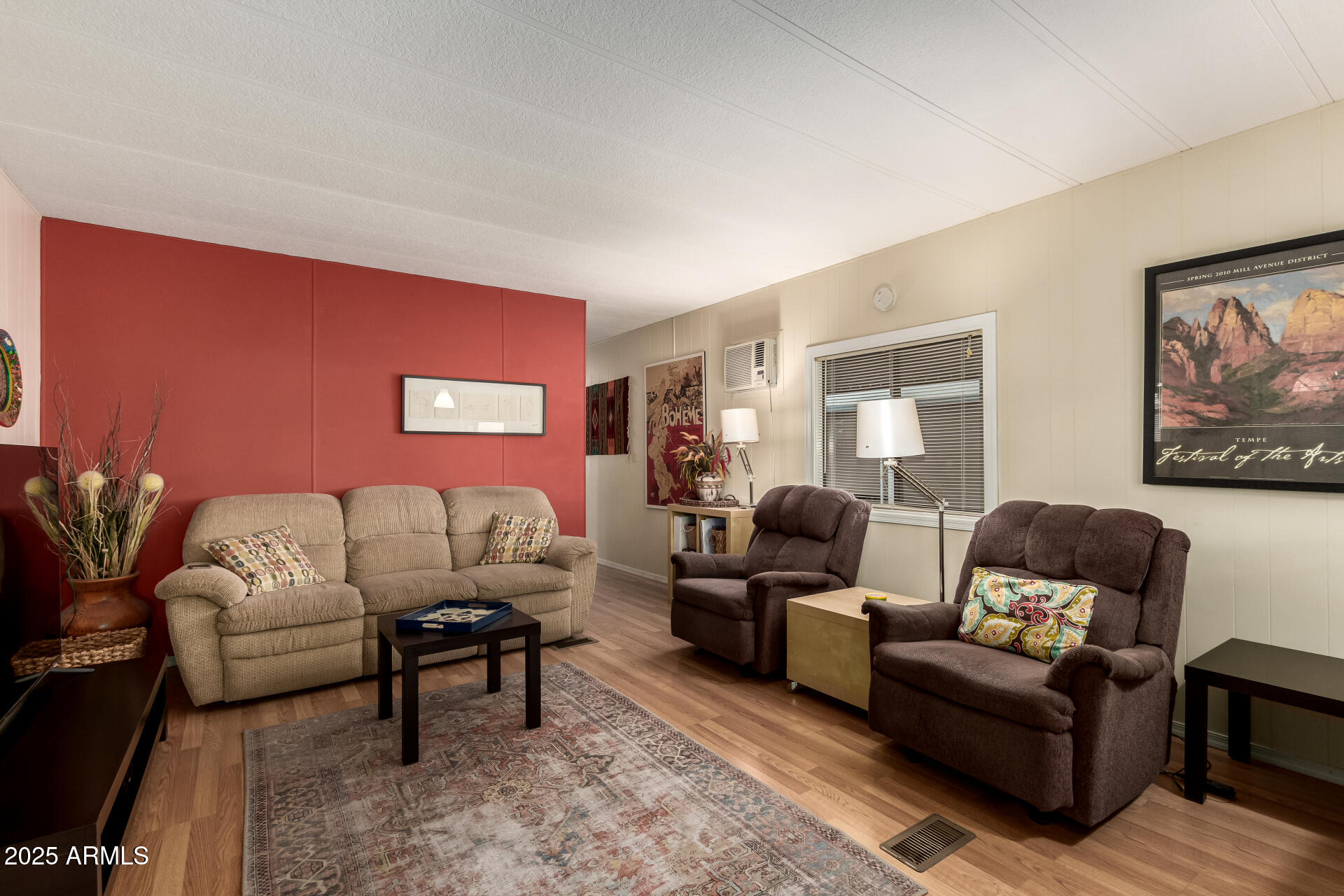 11425 East University Drive, Unit 53 Apache Junction, AZ 85120 - Photo 6 of 29 a living room with furniture and a wooden floor
