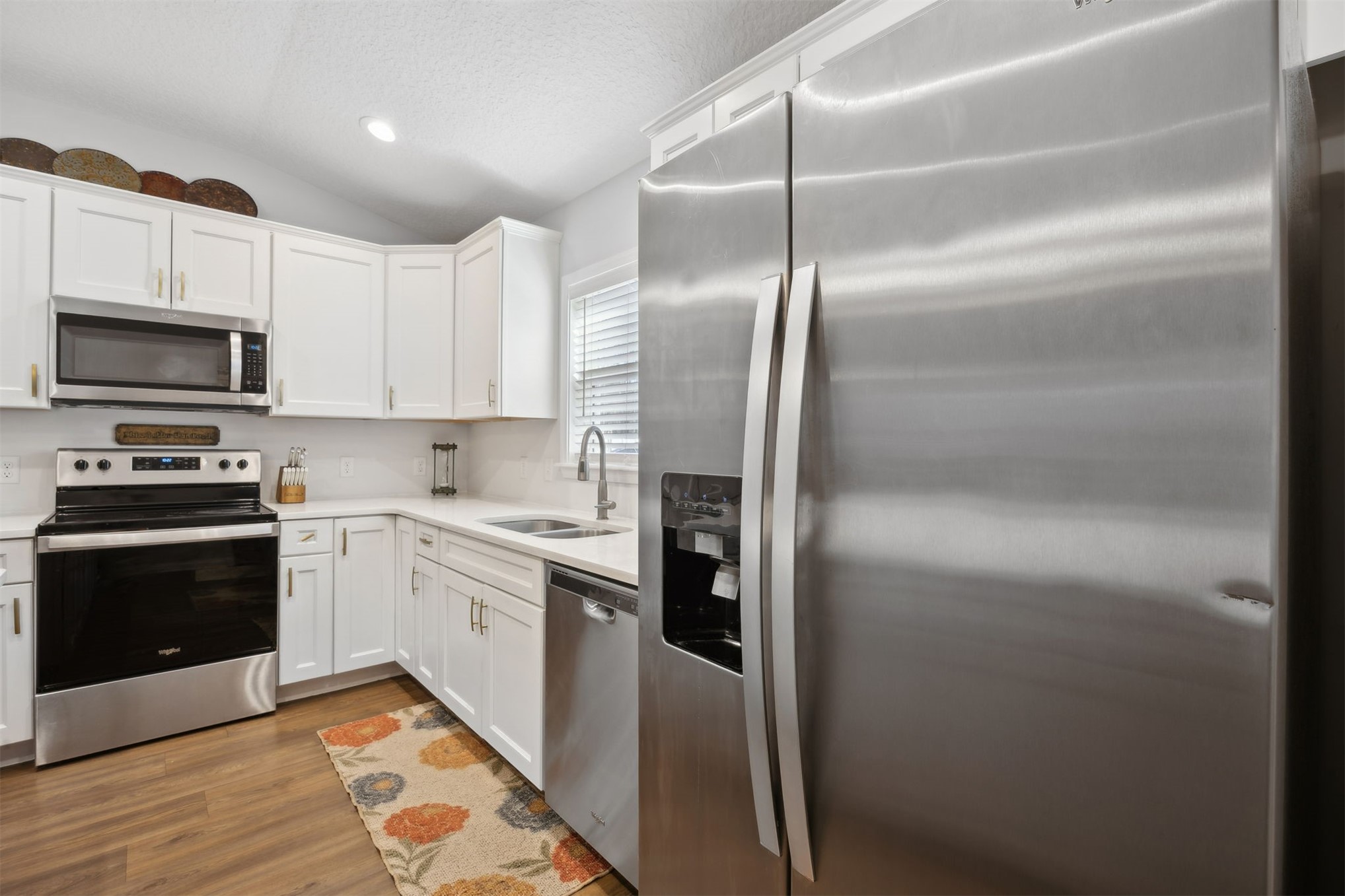 45480 Musslewhite Road Callahan, FL 32011 - Photo 12 of 31 a kitchen with cabinets and stainless steel appliances