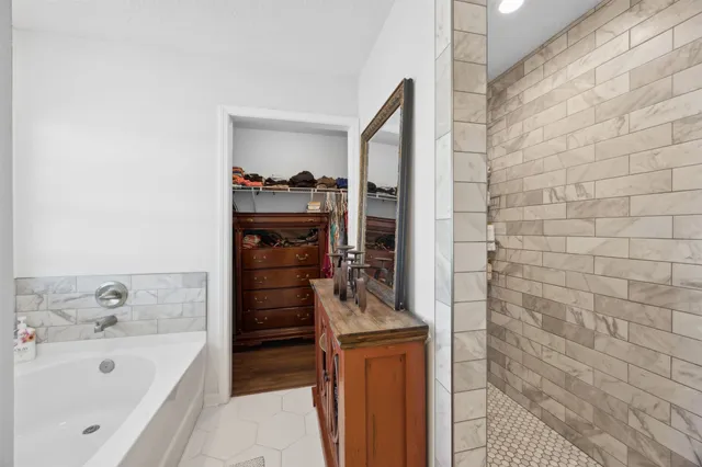 a bathroom with a bathtub and a sink