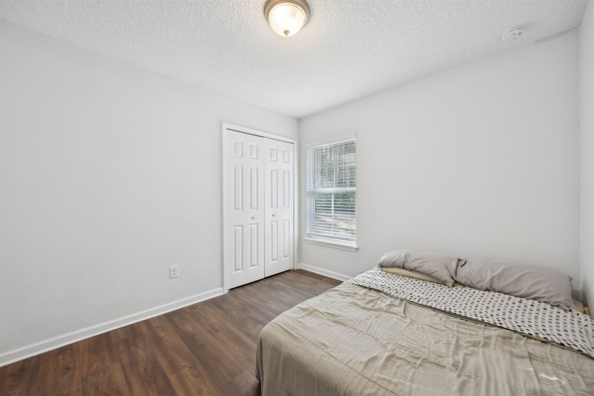 45480 Musslewhite Road Callahan, FL 32011 - Photo 23 of 31 a bedroom with a bed and a window