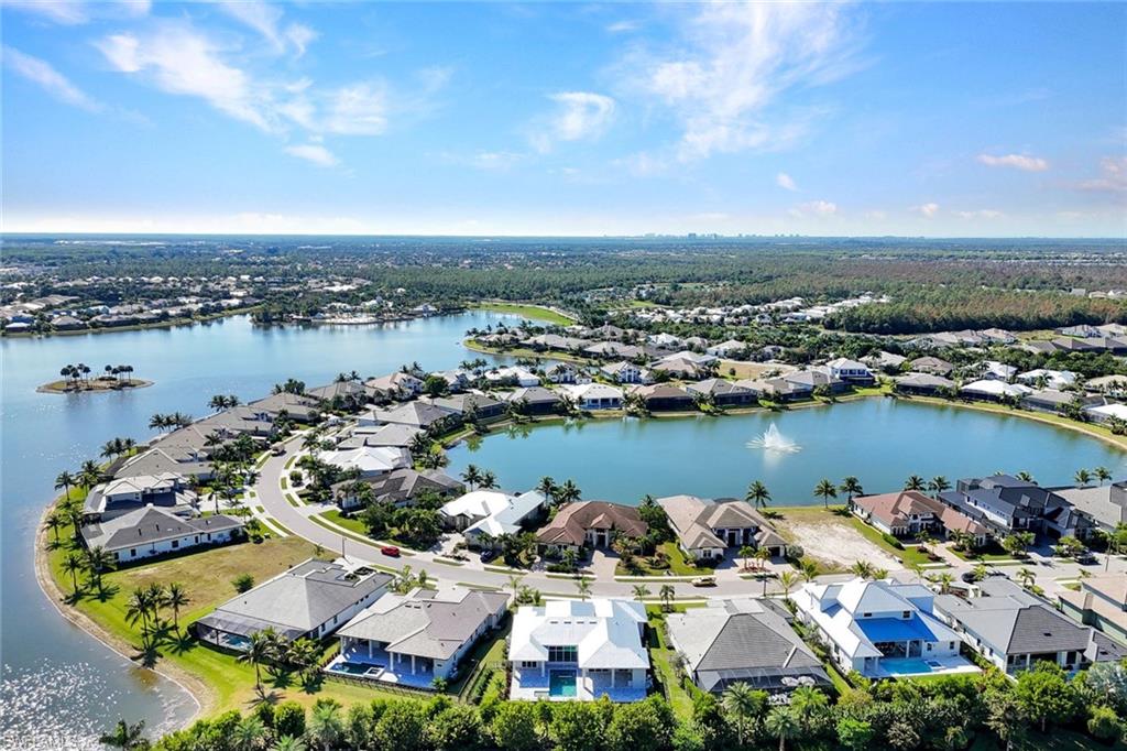 14286 Charthouse Circle Naples, FL 34114 - Photo 34 of 47 Aerial view of residential area with a nearby body of water