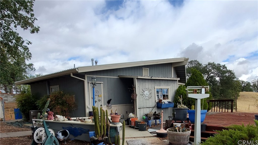 7404 Smith Road Corning, CA 96021 - Photo 1 of 1 a front view of a house with yard