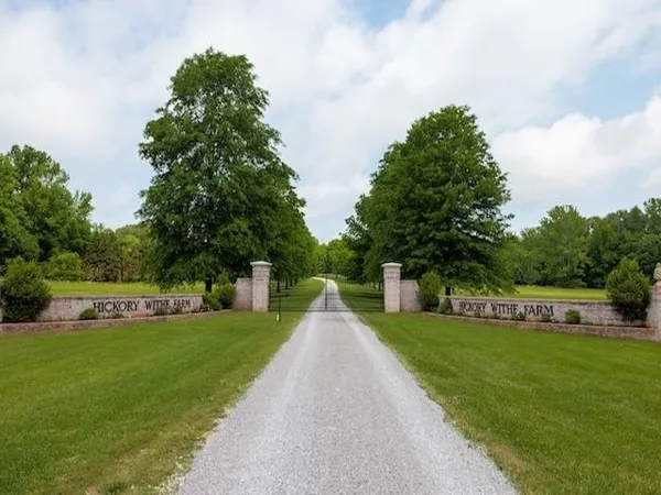 a front view of a building with a yard