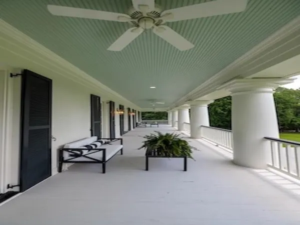 a view of a balcony with a floor to ceiling window