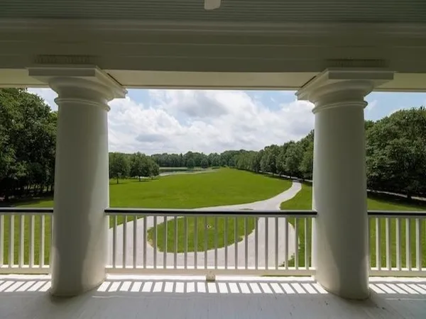 a view of a table and chairs in the garden