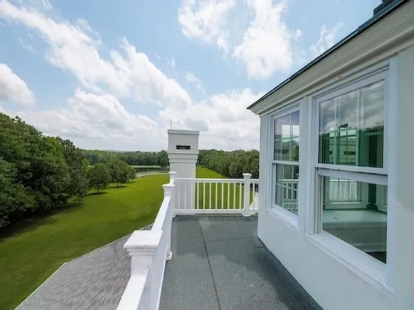 a view of lake with green space