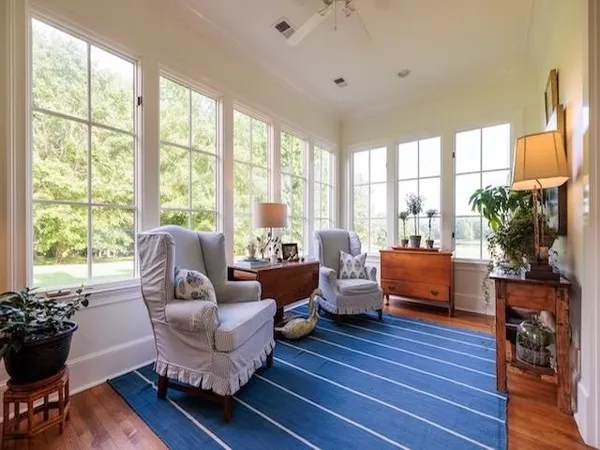 a spacious bedroom with a large bed and a dresser