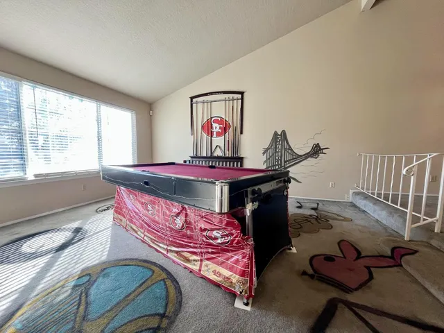 a bedroom with a bed and a table in it