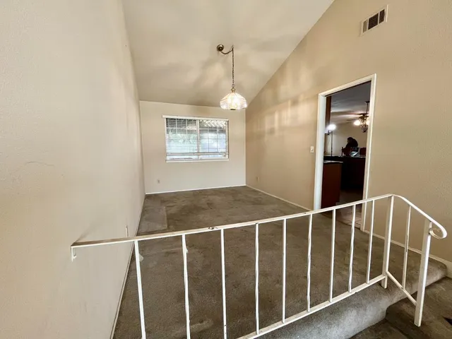 a view of a hallway with windows