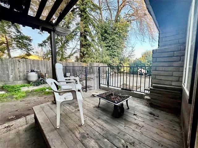 a view of a patio with a table and chairs
