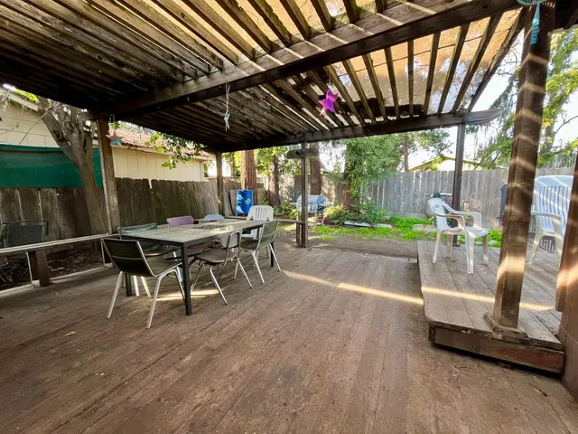 a patio with a table and chairs