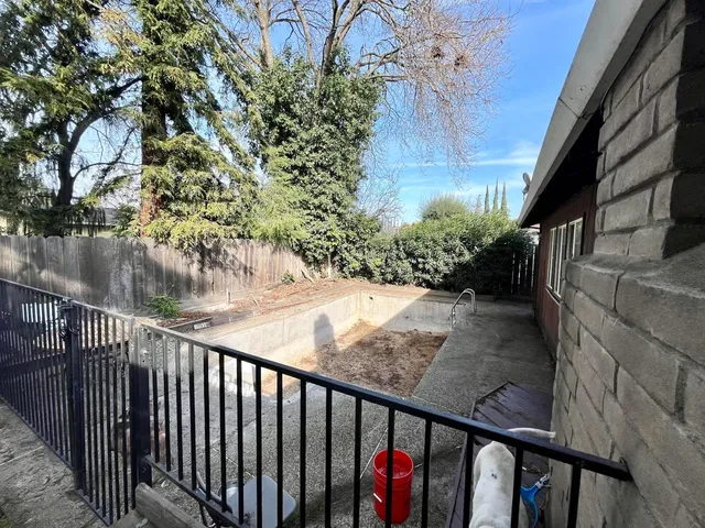 a view of balcony and yard