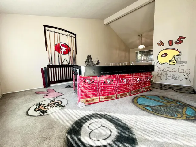 a view of a room that has a couch and a table in it