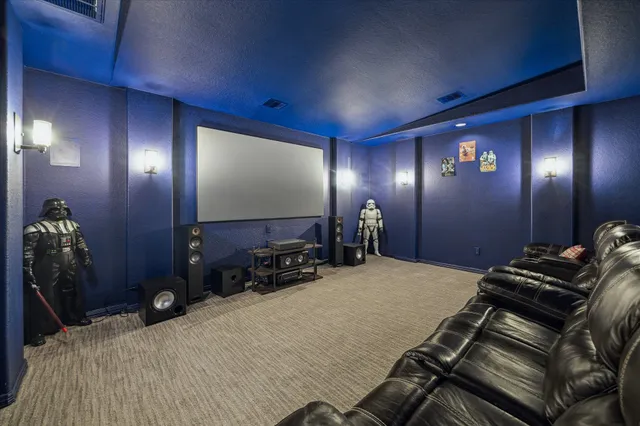 a bedroom with a bed and a mirror