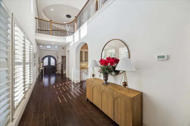 a view of a livingroom with furniture window and wooden floor