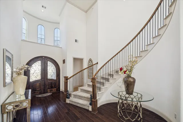 a view of entryway with wooden floor and a front door