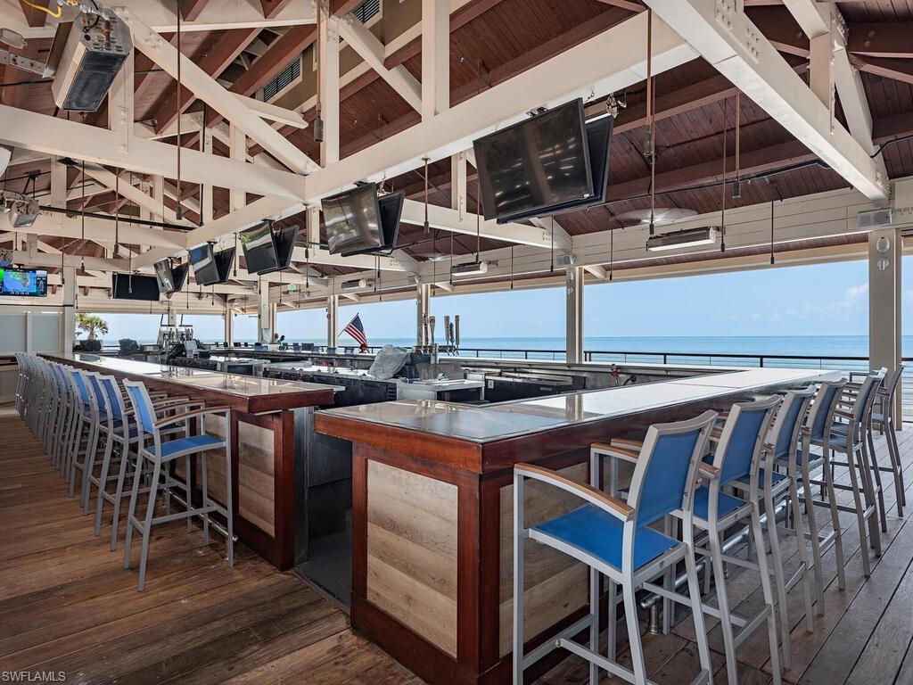 6849 Grenadier Boulevard, Unit 1803 Naples, FL 34108 - Photo 16 of 27 Marker 36, 1 of 2 Pelican Bay private beachfront restaurants/bars with outdoor and indoor dining